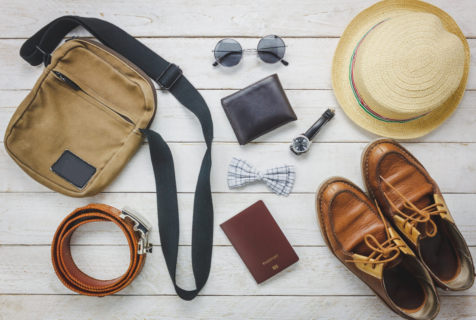 Home layout top view accessoires to travel with man clothing concept. bow ti